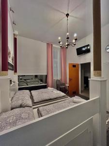 Ένα ή περισσότερα κρεβάτια σε δωμάτιο στο Vienna-Guestroom