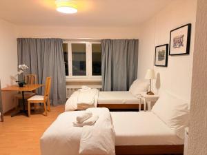 Ένα ή περισσότερα κρεβάτια σε δωμάτιο στο Hostel City Basel 306 +26 φωτογραφίες