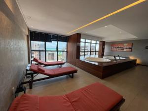 Una cama o camas en una habitación de Apartamento quarto e sala Edifício Time - 1105