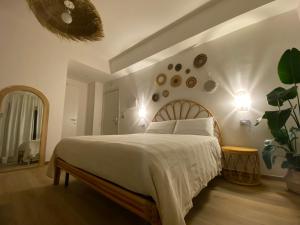 Ένα ή περισσότερα κρεβάτια σε δωμάτιο στο Maison Voyage Messina