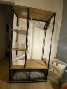 a shelf in a room with some white dishes at Maison Voyage Messina in Messina