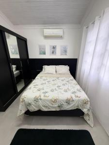 Postel nebo postele na pokoji v ubytování Casa Bertioga Centro