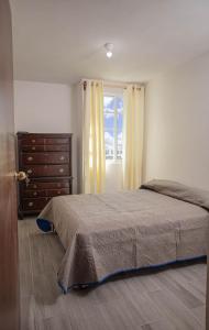 Ένα ή περισσότερα κρεβάτια σε δωμάτιο στο Estancia Buenavista Departamento 4