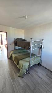 Ένα ή περισσότερα κρεβάτια σε δωμάτιο στο Estancia Buenavista Departamento 4