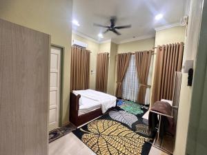 Postel nebo postele na pokoji v ubytování Tengku Resident