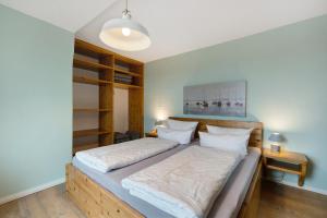 En eller flere senge i et værelse på Landhaus Ostseeblick Fewo 10- + 25 billeder