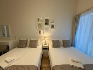 Postel nebo postele na pokoji v ubytování OUCHI HOTEL Hiroshima Station