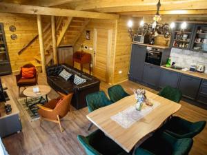 a living room with a table and a couch at Four bedroom villa in Vukovar