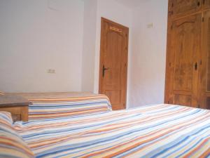 Postel nebo postele na pokoji v ubytování Chalet in El Palmar by the Beach