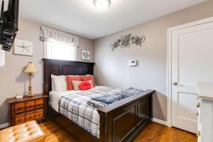 a bedroom with a bed with orange pillows on it at The Cozy Bungalow 3 parking fully fenced yard in Sweet Briar Park