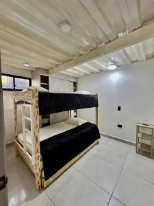 a bedroom with two bunk beds in a room at Finca mi Rancho in Pereira +64 photos