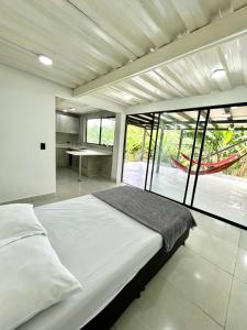 Ένα ή περισσότερα κρεβάτια σε δωμάτιο στο Finca mi Rancho