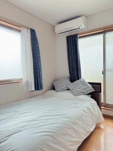 Voodi või voodid majutusasutuse Tazuno-Nakano toas +19 fotot