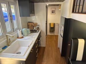 a small kitchen with a sink and a stove at Big Tiny Medlow in Medlow Bath