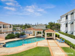 a swimming pool in the backyard of a house at Villa 7 - The Breakers Resort in Yamba