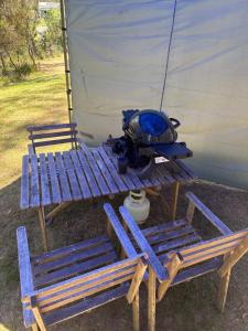 two blue chairs and a table and a tent at Big Tiny Medlow in Medlow Bath
