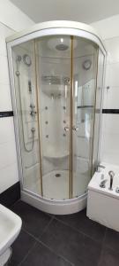 a bathroom with a shower and a sink at Camunda in Punta del Este