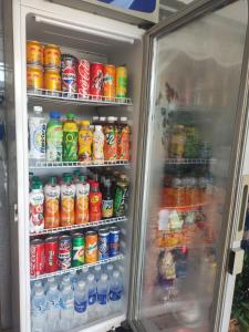 an open refrigerator filled with lots of drinks at Nhà nghỉ Đông Phương in Trung An