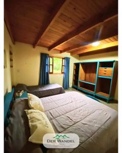 En eller flere senge i et værelse på Casa Der Wandel