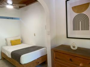 Ένα ή περισσότερα κρεβάτια σε δωμάτιο στο Casa Hidalgo Hideaway