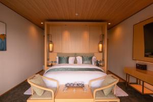 Ένα ή περισσότερα κρεβάτια σε δωμάτιο στο Tsuru Yoshikawa Onsen