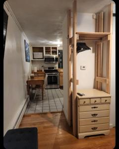 a kitchen with a door open to a dining room at Quiet, Convenient Studio Andover Merrimack Valley - Long Stays Only in Andover