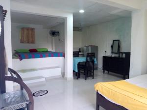 a bedroom with a bed and a table in it at Villa Jungle Paradise in Unawatuna +105 photos