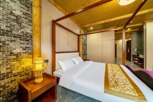 Giường trong phòng chung tại 上海万珍酒店Shanghai Wanzhen Resort Hotel