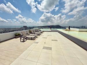 a row of chairs sitting on top of a building at BlueMar Cartagena in Cartagena de Indias
