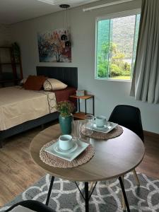 Ένα ή περισσότερα κρεβάτια σε δωμάτιο στο Casa em Florianopolis Praia do Moçambique