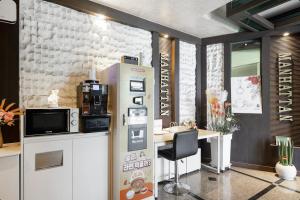 Η κουζίνα ή μικρή κουζίνα στο Yeosu Manhattan Hotel