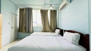 Ένα ή περισσότερα κρεβάτια σε δωμάτιο στο Jasmin Guest House