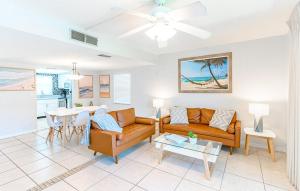 a living room with a couch and a table at Cocoa Beach Club in Cocoa Beach