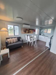 a living room with a couch and a table at Country Cottage of Yesteryear 