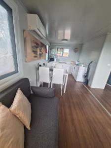 a living room with a couch and a table at Country Cottage of Yesteryear 