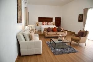 a living room with two couches and a table at Tropical Garden Luxury Villa, Koh Phangan in Koh Phangan +60 photos