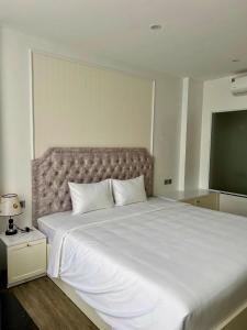 Postel nebo postele na pokoji v ubytování The Serenity Residence Ha Noi