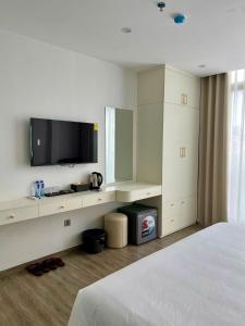 TV a/nebo společenská místnost v ubytování The Serenity Residence Ha Noi + 21 fotografií