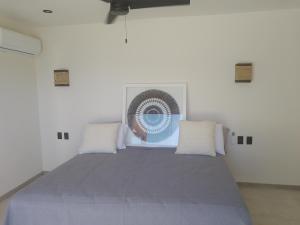 Ένα ή περισσότερα κρεβάτια σε δωμάτιο στο Balcones del sol ph