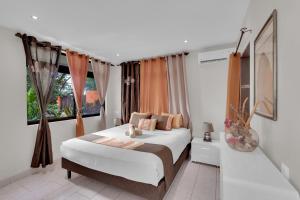 Ένα ή περισσότερα κρεβάτια σε δωμάτιο στο Tahiti beach house