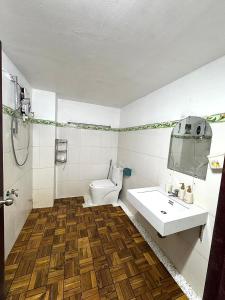 a bathroom with a toilet and a sink at Golden Hotel in Buon Ma Thuot +36 photos