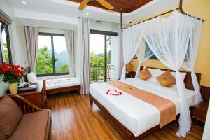 Ένα ή περισσότερα κρεβάτια σε δωμάτιο στο Central Hills Pu Luong Resort
