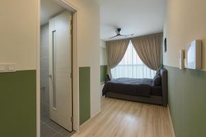 Ένα ή περισσότερα κρεβάτια σε δωμάτιο στο Macrolink Medini Signature Suite near Legoland by Our Stay +74 φωτογραφίες