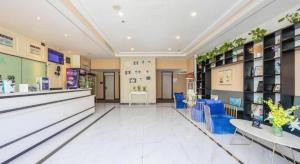 a store lobby with blue chairs and a counter at Xana Lite Beijing Liangxiang University City Branch in Wangzhuang