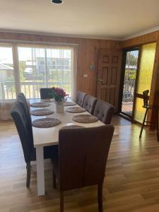 a dining room with a table and chairs at 41 Bailey Rd - Family - Surf Beach - No Linen Included in Middleton