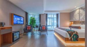 TV a/nebo společenská místnost v ubytování James Joyce Coffetel Hefei University of Technology