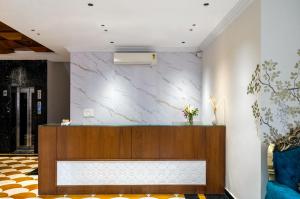 a lobby with a marble wall at The Classic Crown Udaipur - A Luxury Hotel by Lake Pichola in Jāmb