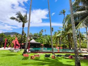 a resort with a pool and palm trees at Siam Royal View Resort Apartments in Ko Chang