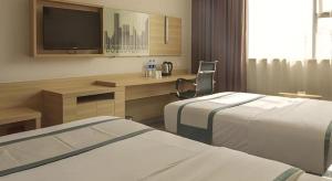 Postel nebo postele na pokoji v ubytování City Comfort Inn Guangzhou Zengcheng Yonghe Yongkang Road