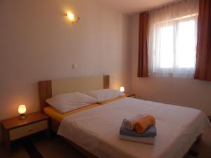 Postel nebo postele na pokoji v ubytování Apartments Sofija